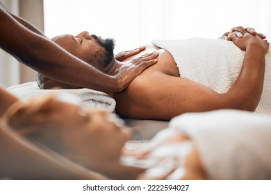 Black Man, Spa And Couple Massage For Relax, Skincare And Wellness At Resort On Anniversary Weekend. Reflexology Therapist Touch Body Muscle Of Sleeping Guy On Salon Bed, Stress Relief And Zen Detox