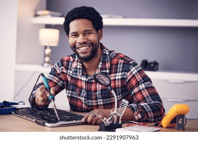 Black man, technician fixing electronics and tablet hardware, soldering iron tools and tech repair. Maintenance, magnifying glass and electrical fix with happy male in portrait working on device