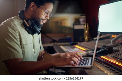 Black man, thinking and laptop for music recording, sound engineering or song composition in studio. Producer, DJ and musician on technology with ideas for live streaming radio, audio or media album - Powered by Shutterstock