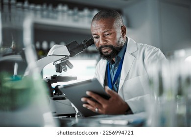 Black man thinking, science and tablet for online research, laboratory and healthcare sample. African American male, scientist or research in lab, digital data and update experiment results and focus - Powered by Shutterstock