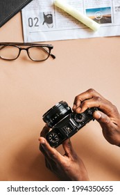 Black man using an analog camera