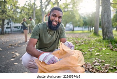 Black man, volunteer portrait and plastic bag for community park cleanup, recycling or cleaning. Ngo person outdoor in nature to recycle, earth day or happy about a clean from pollution enviroment - Powered by Shutterstock