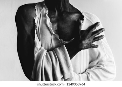 Black Man Wearing A Torn, Distressed, White Shirt