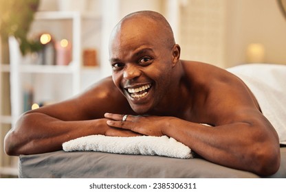 Black man, wellness and relax in spa portrait with happiness, excited and smile on massage bed at resort. Man, happy and vacation for health, peace and calm for self care, retreat or physical therapy - Powered by Shutterstock