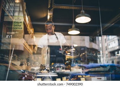 Black Man Works In Pastry Shop.