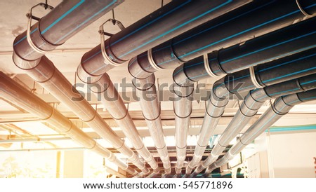 Black manage water pipe, safety and clean watering system in condominium or modern building construction.