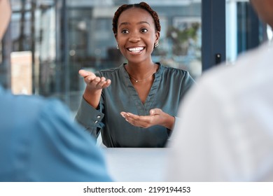 Black manager, advisor or coach during business meeting while talking, speaking and explaining strategy or vision in office. African american woman planning and discussing collaboration with her team - Shutterstock ID 2199194453