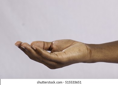Black man's hand, palm up to receive