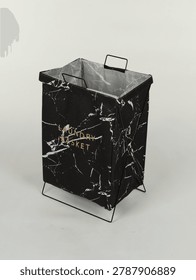 Black marble pattern laundry basket with metal frame isolated on white background