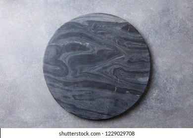 Black Marble Texture Board On Grey Background. Top View. Copy Space.