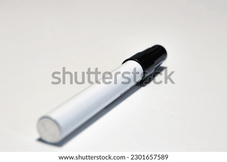 a black marker lying on the table