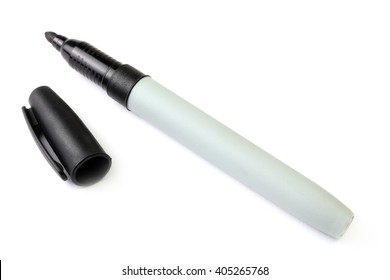 Black marker pen with cap off on a white background