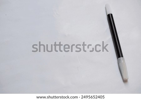 Black marker with white background.