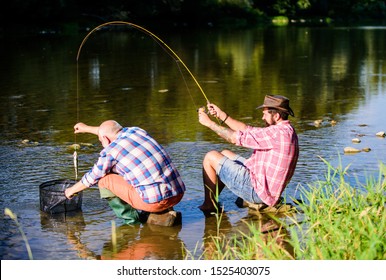 Black Market Caviar. Illegal Hunting Caviar. Extracts Eggs From Sturgeon Caught River. Trap For Fish. Men Sit At Riverside With Fishing Equipment. Poaching Crime And Fishing License. Poachers Fishing.