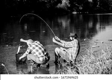 Black Market Caviar. Illegal Hunting Caviar. Extracts Eggs From Sturgeon Caught River. Poaching Crime And Fishing License. Poachers Fishing. Trap For Fish. Men Sit At Riverside With Fishing Equipment.