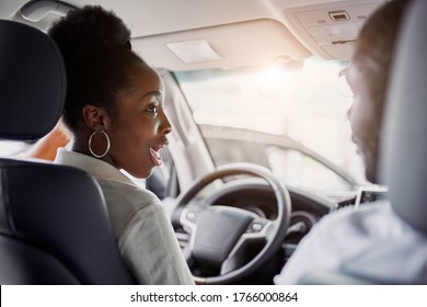 Black Married Family Examining Car From Inside, They Are Checking Convenience And Look Characteristics Of Automobile In Dealership, Want To Buy It