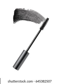 Black mascara brush stroke with applicator brush isolated on white