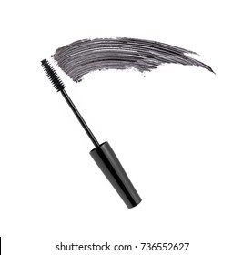 Black mascara brush stroke with applicator brush isolated on white