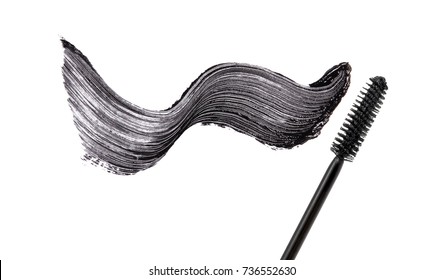 Black mascara brush stroke with applicator brush isolated on white