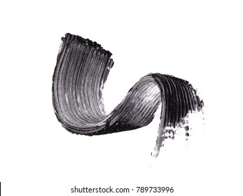 Black mascara brush strokes isolated on white