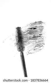 Black Mascara Brush And Swatch On A White Background. Minimalistic Cosmetic Concept.