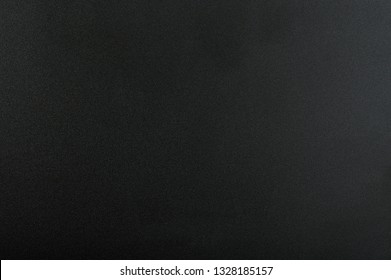 Black matte background. Surface of abstract dark texture