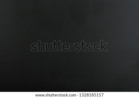 Black matte background. Surface of abstract dark texture