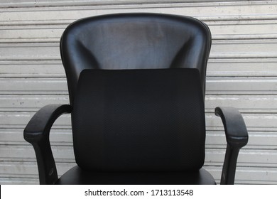 Black Memory Foam Lumbar Support Cushion/pillow In Black Office Chair With Grey Background Close Up