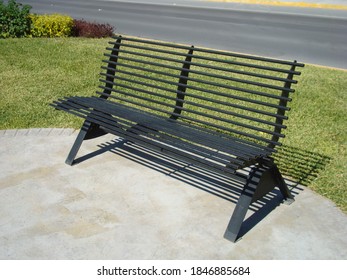 Black Metal Bench In Urban Park