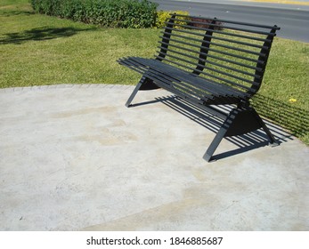 Black Metal Bench In Urban Park