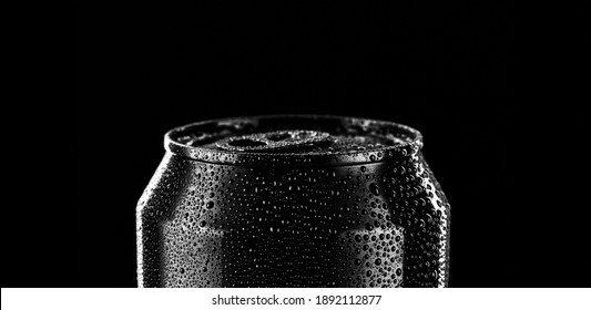 Black Metal Can. Black Alluminium Can Of Beer, Lemonade Or Tonic Isolated On Black Background. Empty Packaging Mockup With No Label