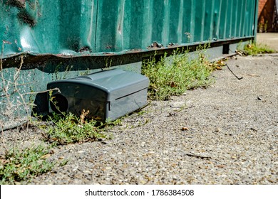 Black Metal External Rodent Rat Bait Station Outside Against A Wall Close Up.  Pest Control.