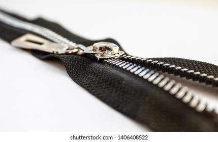 Black Metal Open Zipper Closeup Isolated On White Background Macro