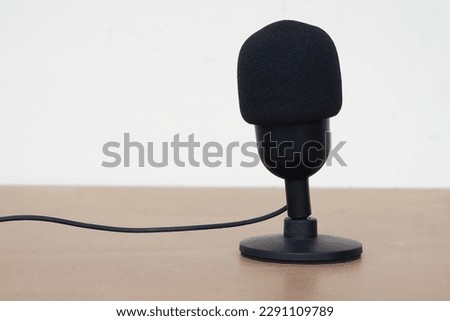 Black microphone. Concept, technology device, microphone usb, useful for sound, voice recording, live streaming. On air, broadcasting.                                                              