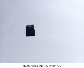 Black MicroSD to SDHC memory card adapter isolated on plain white background, ideal for storage, data transfer, and technology concepts.