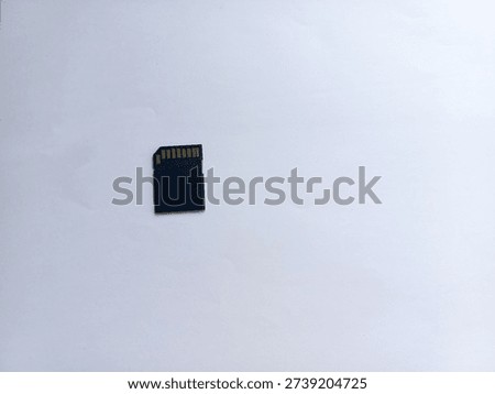 Black MicroSD to SDHC memory card adapter isolated on plain white background, ideal for storage, data transfer, and technology concepts.