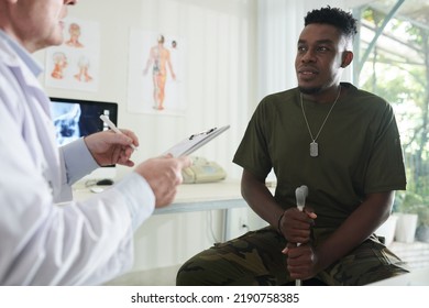 Black Military Man With Cane Visiting Doctor For Annual Check-up