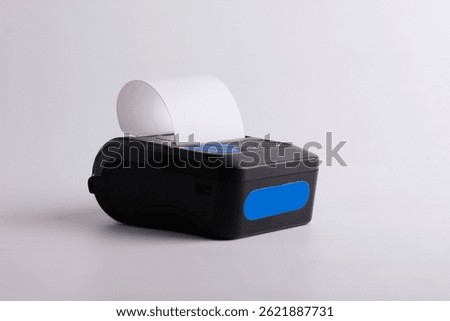 Black mini printer isolated on white background.