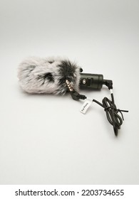 Black Mini Shotgun Mic With Feather Noise Protector Suitable For Display In Your Shop