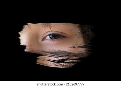 black mirror is painted over with strokes, Human eye is reflected, Young child 10-12 years old looking straight, concept of secrecy, Surveillance System, other world, mystery shrouded in darkness - Shutterstock ID 2152697777