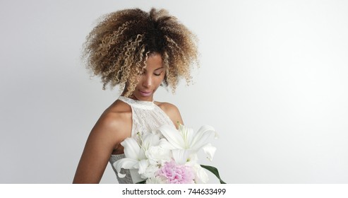 Black Mixed Race Bride With Flowers