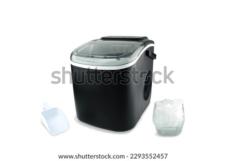 black modern design ice maker is used for making clean ice for various kinds of soft drink during summer on white table with a scoop and a glass of ice isolated on white background ( clipping path )