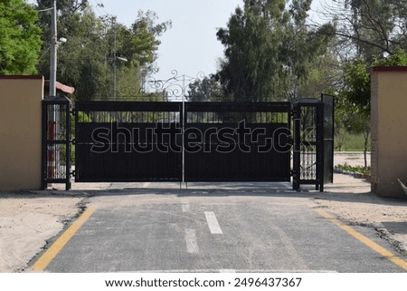 Black modern gate. Black metal garden entrance gates . Modern Black Metal Garden Entrance Gates.Modern Black Metal Garden Entrance Gates.