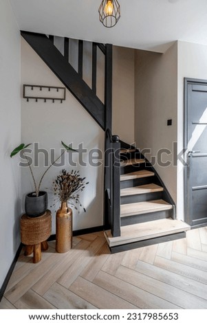 Black modern staircase stairs with beautiful light and floor