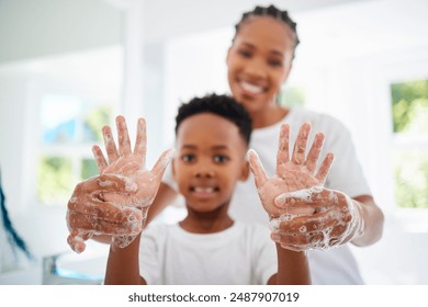 Black mom, boy and smile for hands with soap in home for hygiene, care and support with child development. Parent, kid and happy or excited on portrait with handwashing for germs and bacteria - Powered by Shutterstock