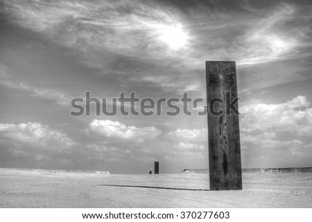 Black monolith in the desert, Qatar