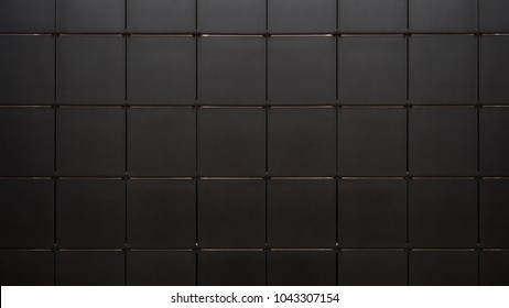 Black mosaic tile wall seamless background and texture