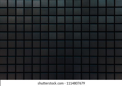 Black mosaic wall pattern and seamless background