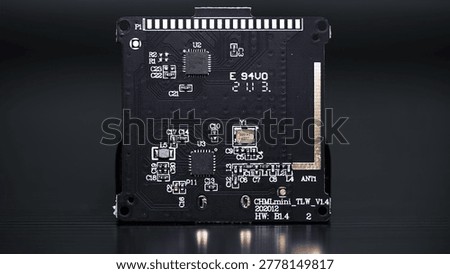 black motherboard with chipsets, memory modules, transistors and contacts