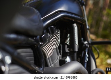 Black Motorcycle Engine Block With Cooling Radiators, Pipes And Gas Tank